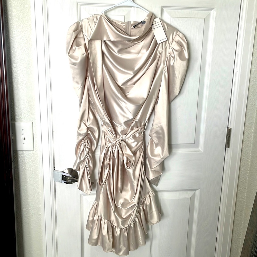 Brand new with tags, Cream colored long sleeve satin dress.